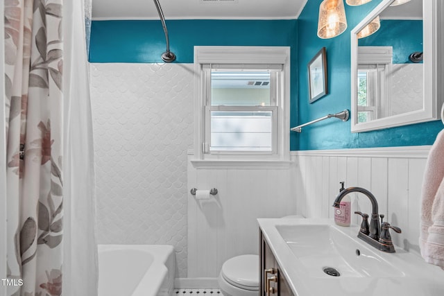 1209 Edgevale Rd, Durham, NC 27701 - bathroom with vanity, shower / bath combo with shower curtain, and wainscoting