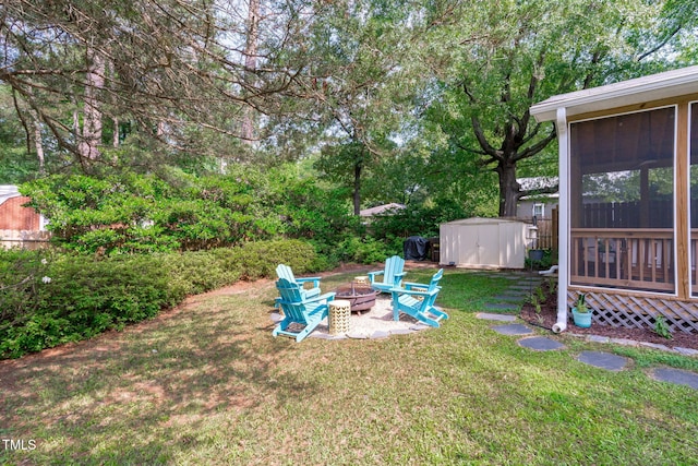1209 Edgevale Rd, Durham, NC 27701 - view of grassy yard featuring a fire pit, a shed, and a sunroom