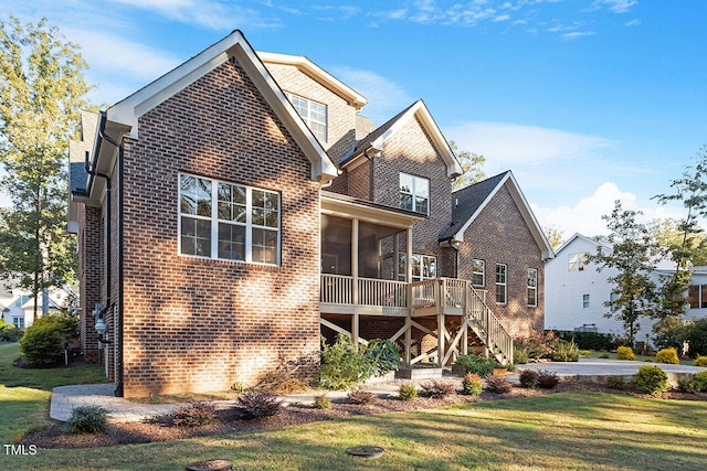 rear view of house with a yard