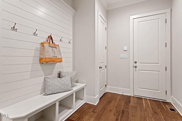 mudroom with crown molding and dark hardwood / wood-style floors