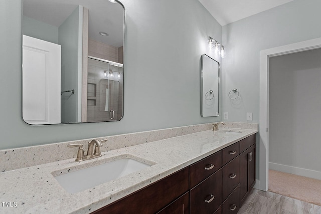 bathroom with vanity and walk in shower