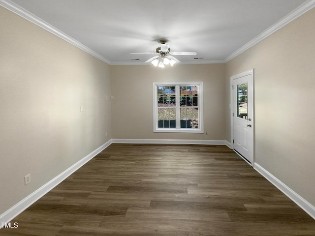 spare room with ornamental molding, ceiling fan, and dark wood-type flooring