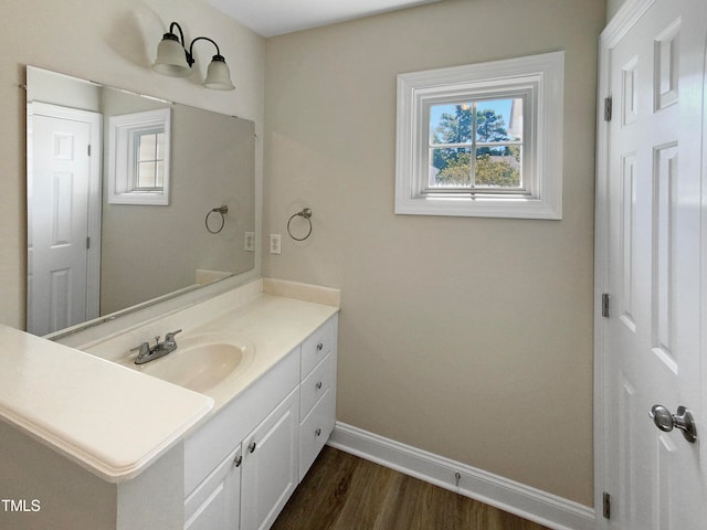 bathroom featuring vanity and hardwood / wood-style flooring