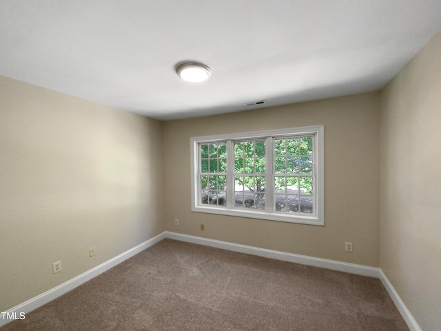 unfurnished room with carpet floors