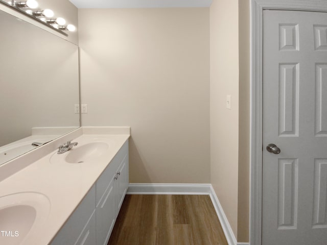 bathroom featuring hardwood / wood-style floors and vanity