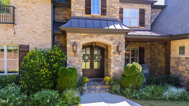 property entrance featuring french doors