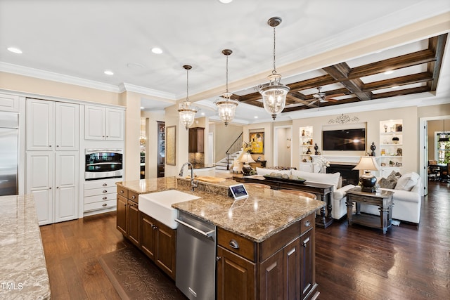 kitchen with pendant lighting, a kitchen island with sink, coffered ceiling, stainless steel appliances, and dark hardwood / wood-style floors