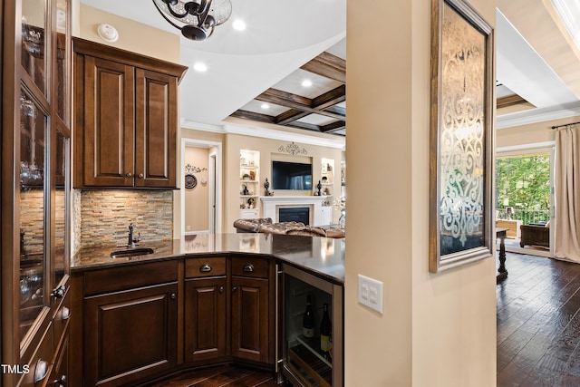 kitchen with wine cooler, sink, dark brown cabinets, coffered ceiling, and dark hardwood / wood-style flooring