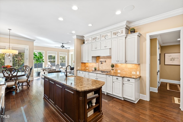 kitchen featuring sink, dark wood-type flooring, and white cabinetry