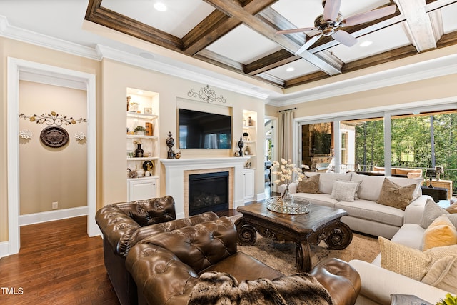 living room with coffered ceiling, ornamental molding, beam ceiling, and dark wood-type flooring