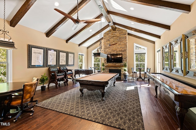 game room with a stone fireplace, hardwood / wood-style floors, and a healthy amount of sunlight