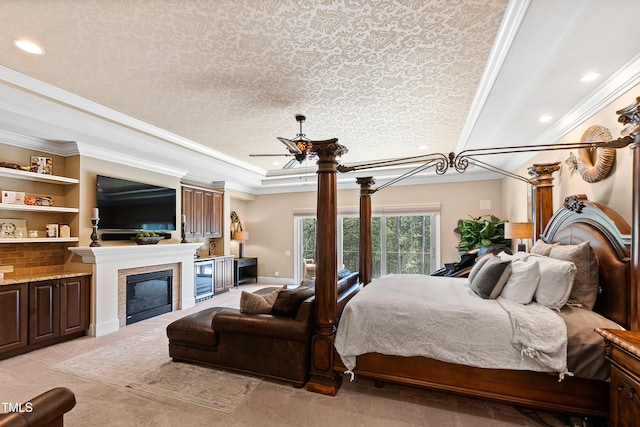 bedroom with ornamental molding, ceiling fan, and a textured ceiling