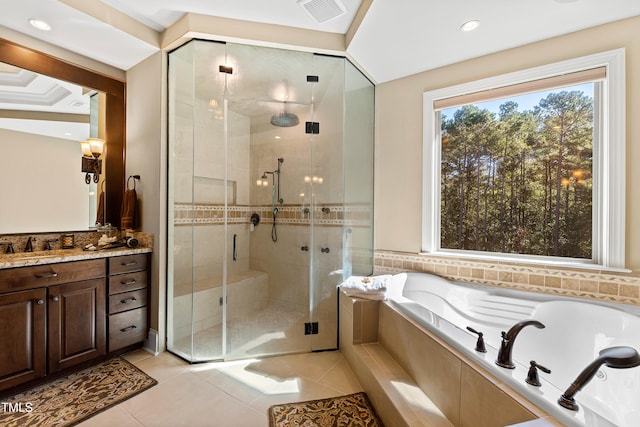 bathroom featuring independent shower and bath, vanity, and tile patterned flooring