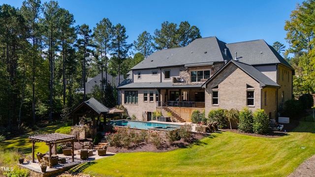 back of house with a lawn and a patio area