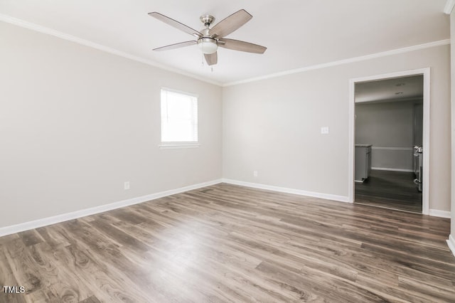 empty room featuring ornamental molding, wood-type flooring, and ceiling fan