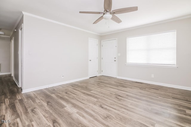 unfurnished room featuring ornamental molding, wood-type flooring, and ceiling fan