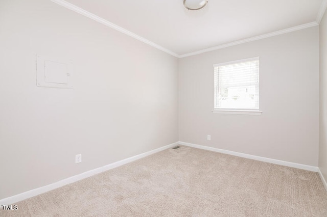 carpeted spare room with ornamental molding