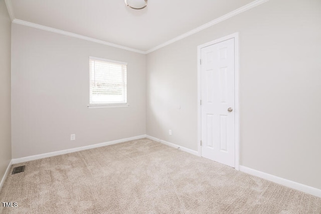 carpeted empty room with ornamental molding