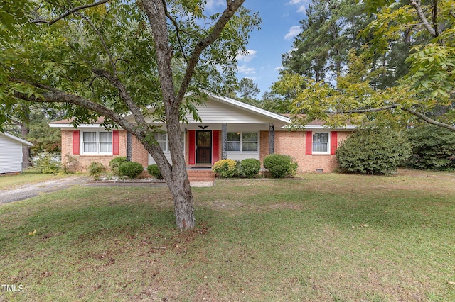 single story home with crawl space, brick siding, and a front yard