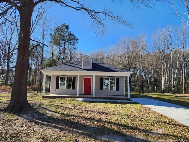 view of front of home featuring covered porch and a front lawn