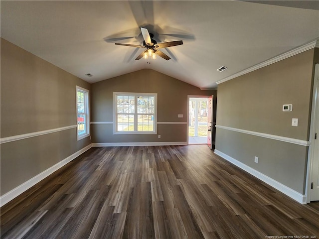 unfurnished room with ceiling fan, dark hardwood / wood-style flooring, lofted ceiling, and ornamental molding