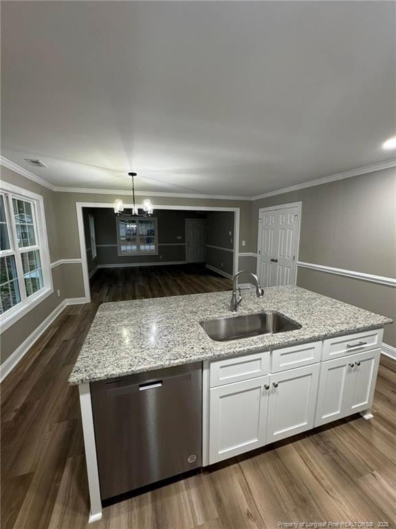 kitchen featuring white cabinets, sink, stainless steel dishwasher, light stone countertops, and decorative light fixtures