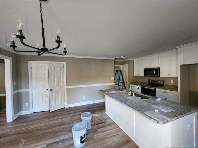 kitchen featuring sink, an inviting chandelier, dark stone countertops, black electric range, and white cabinetry