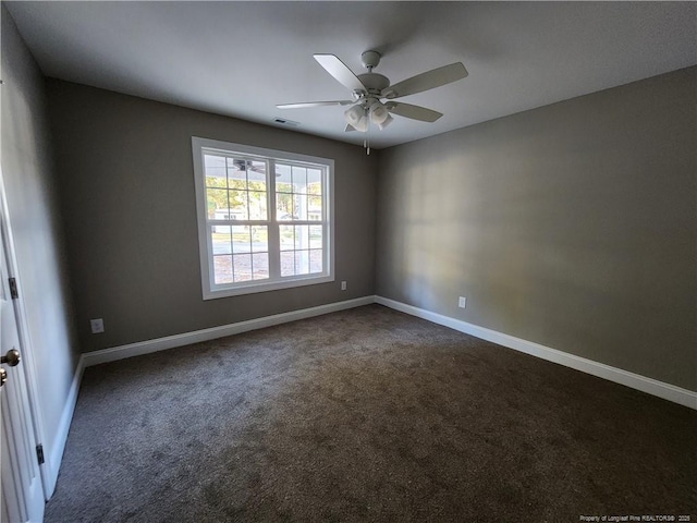 empty room with carpet and ceiling fan