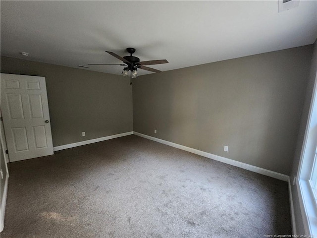 carpeted empty room featuring ceiling fan