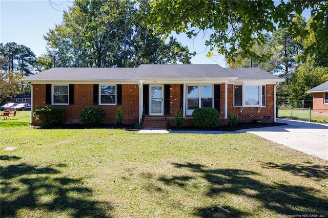 ranch-style home with a front yard