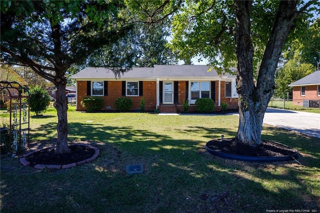 ranch-style house featuring a front lawn