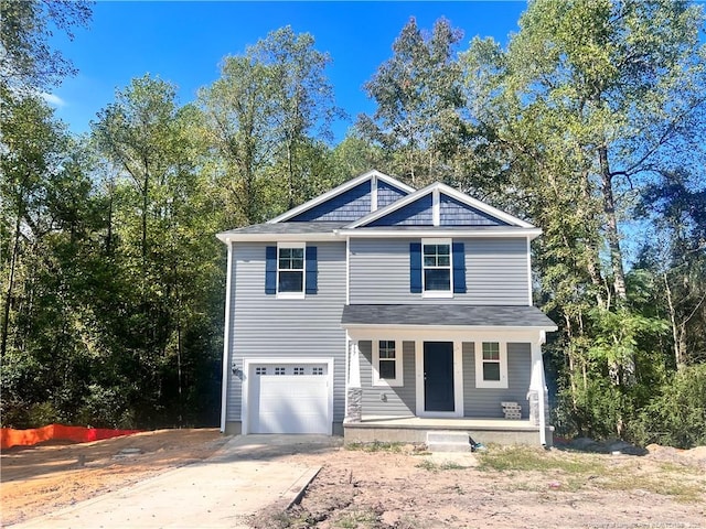 view of front of property with a porch and a garage