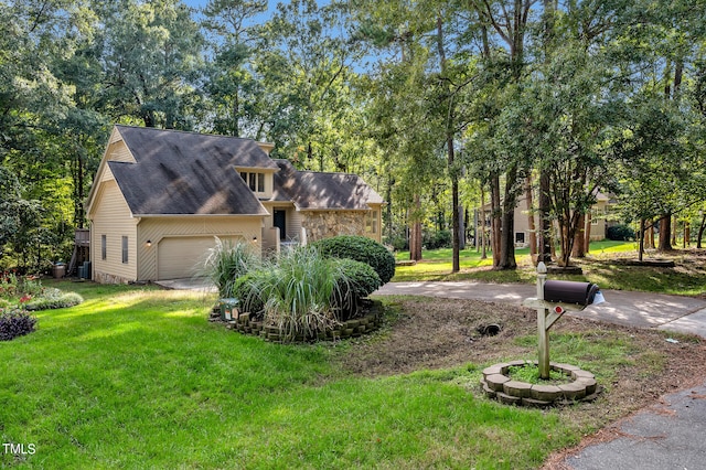 view of front of home with central air condition unit, a garage, and a front lawn