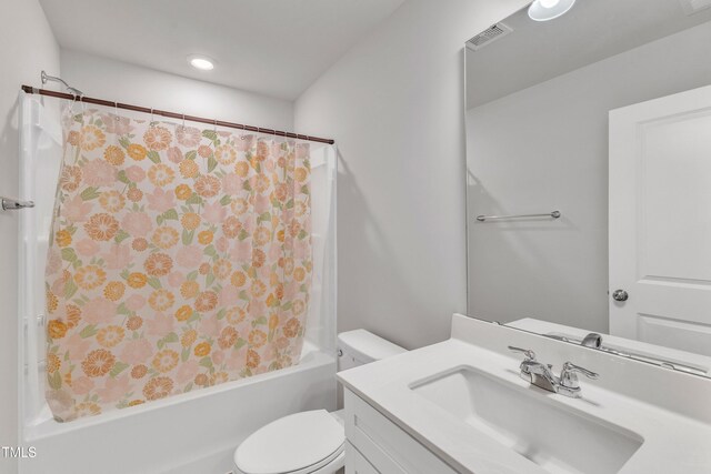 full bathroom featuring vanity, toilet, and shower / bathtub combination with curtain