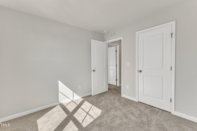 unfurnished bedroom with light carpet