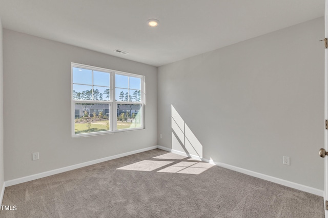 empty room with light colored carpet