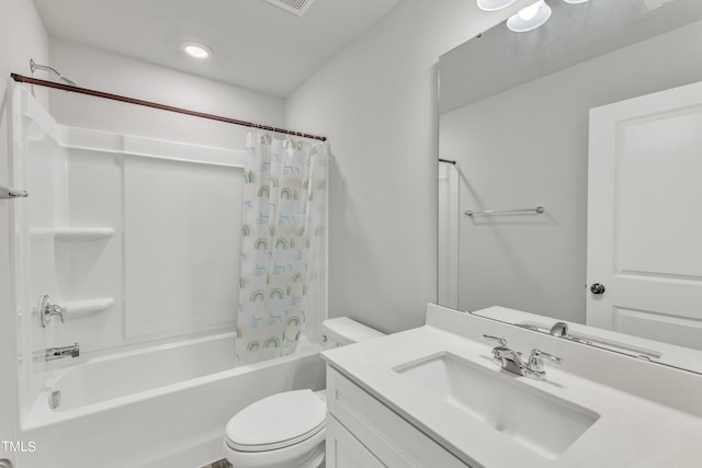 full bathroom with vanity, shower / bath combo, and toilet