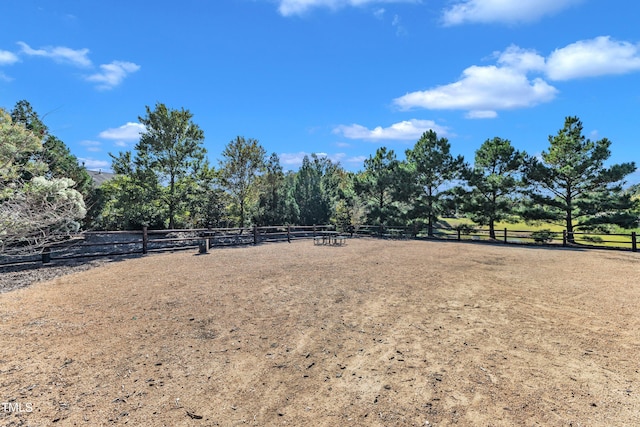 view of yard with a rural view