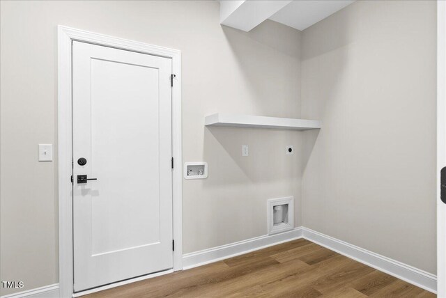 laundry area with hardwood / wood-style flooring and electric dryer hookup