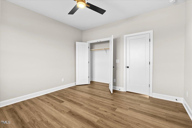 unfurnished bedroom featuring wood-type flooring and ceiling fan