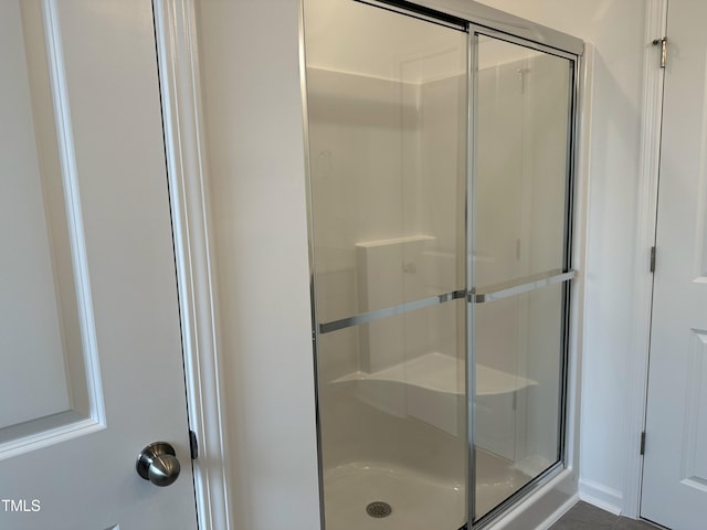 bathroom featuring an enclosed shower