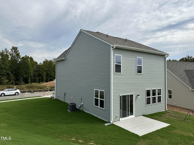 back of house with a lawn