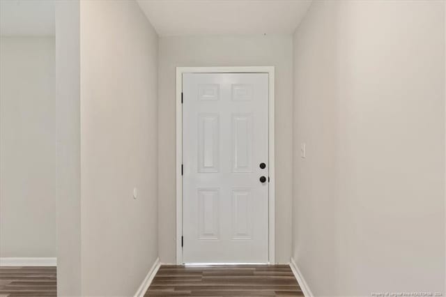 doorway featuring dark hardwood / wood-style floors