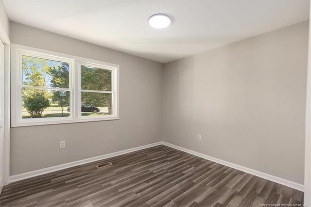 empty room featuring dark hardwood / wood-style floors