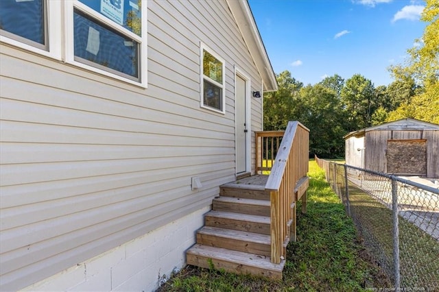 view of home's exterior featuring a shed