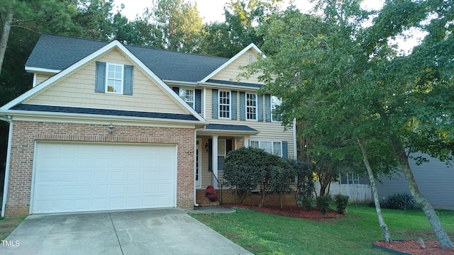 view of front facade featuring a front yard and a garage