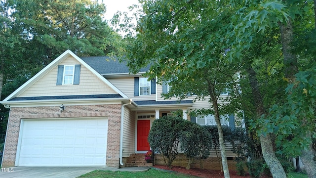 65 Applegate Dr, Franklinton, NC 27525 - view of front facade featuring brick siding, driveway, and a shingled roof