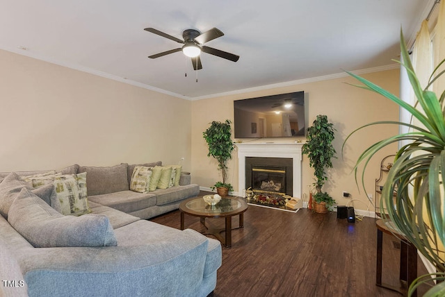 living room featuring ornamental molding, wood-type flooring, and ceiling fan