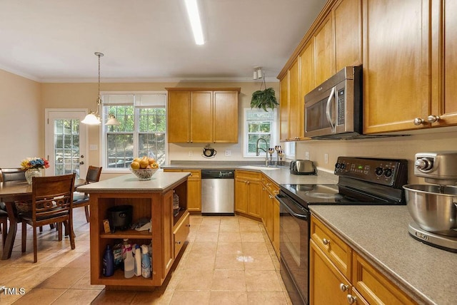 65 Applegate Dr, Franklinton, NC 27525 - kitchen featuring crown molding, open shelves, appliances with stainless steel finishes, a sink, and a kitchen island