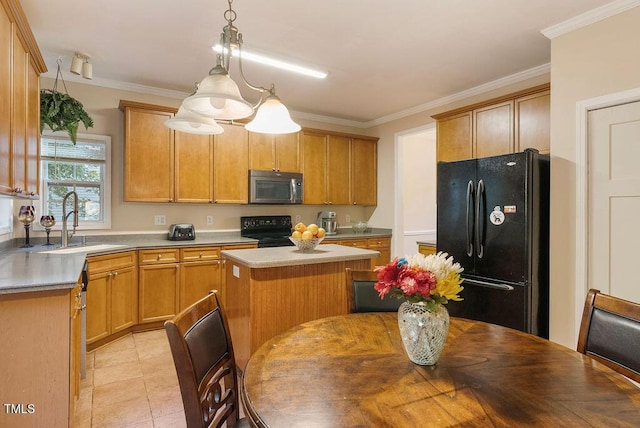 65 Applegate Dr, Franklinton, NC 27525 - kitchen featuring a kitchen island, a sink, black appliances, and light countertops